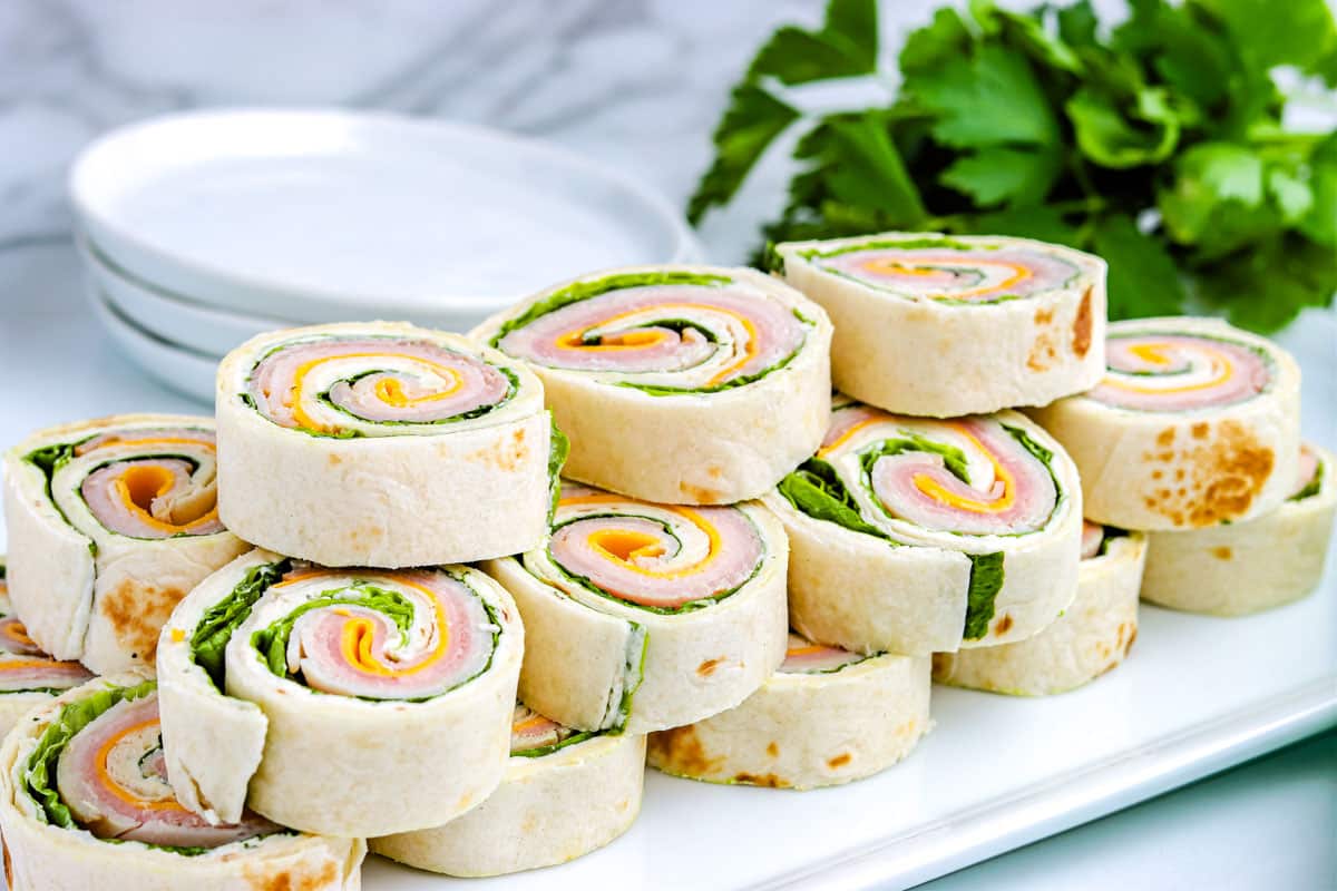 Pinwheel Sandwiches stacked on each other.