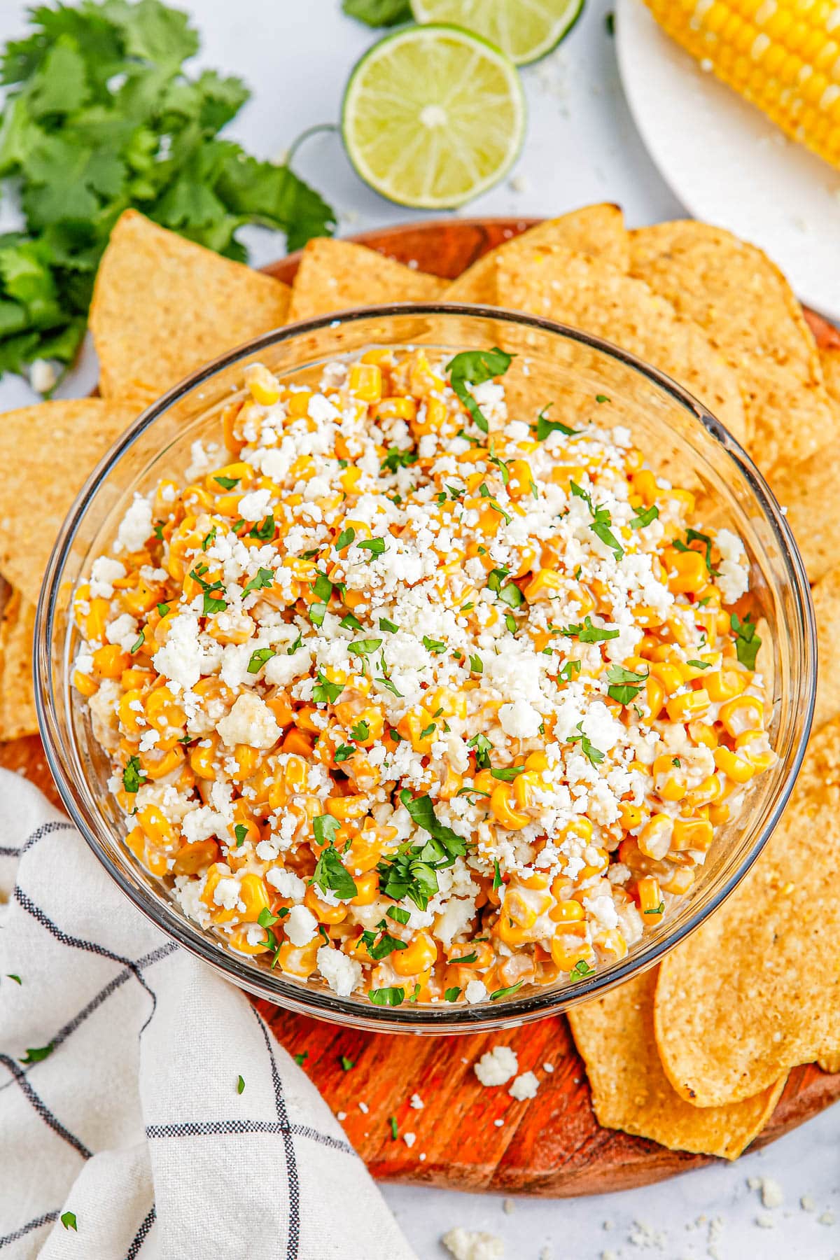 An overhead picture of the finished Mexican Corn Dip in a glass serving bowl.