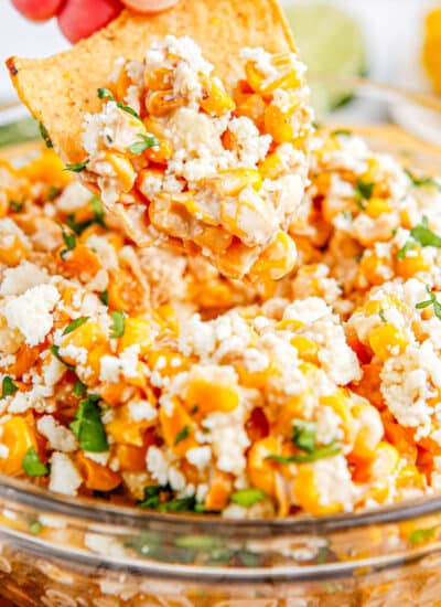 A chip picking up some Mexican Street Corn Dip.