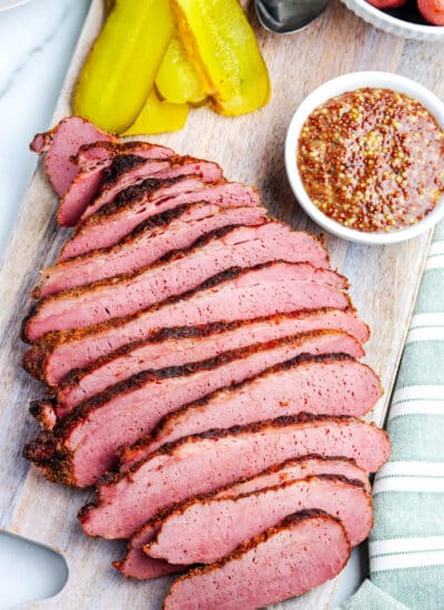 The sliced Smoked Corned Beef on a cutting board.