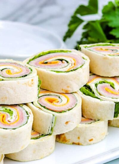 Pinwheel Sandwiches stacked on each other.