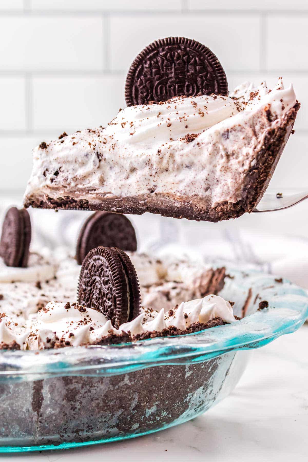 A slice of pie is taken out of the pie plate.