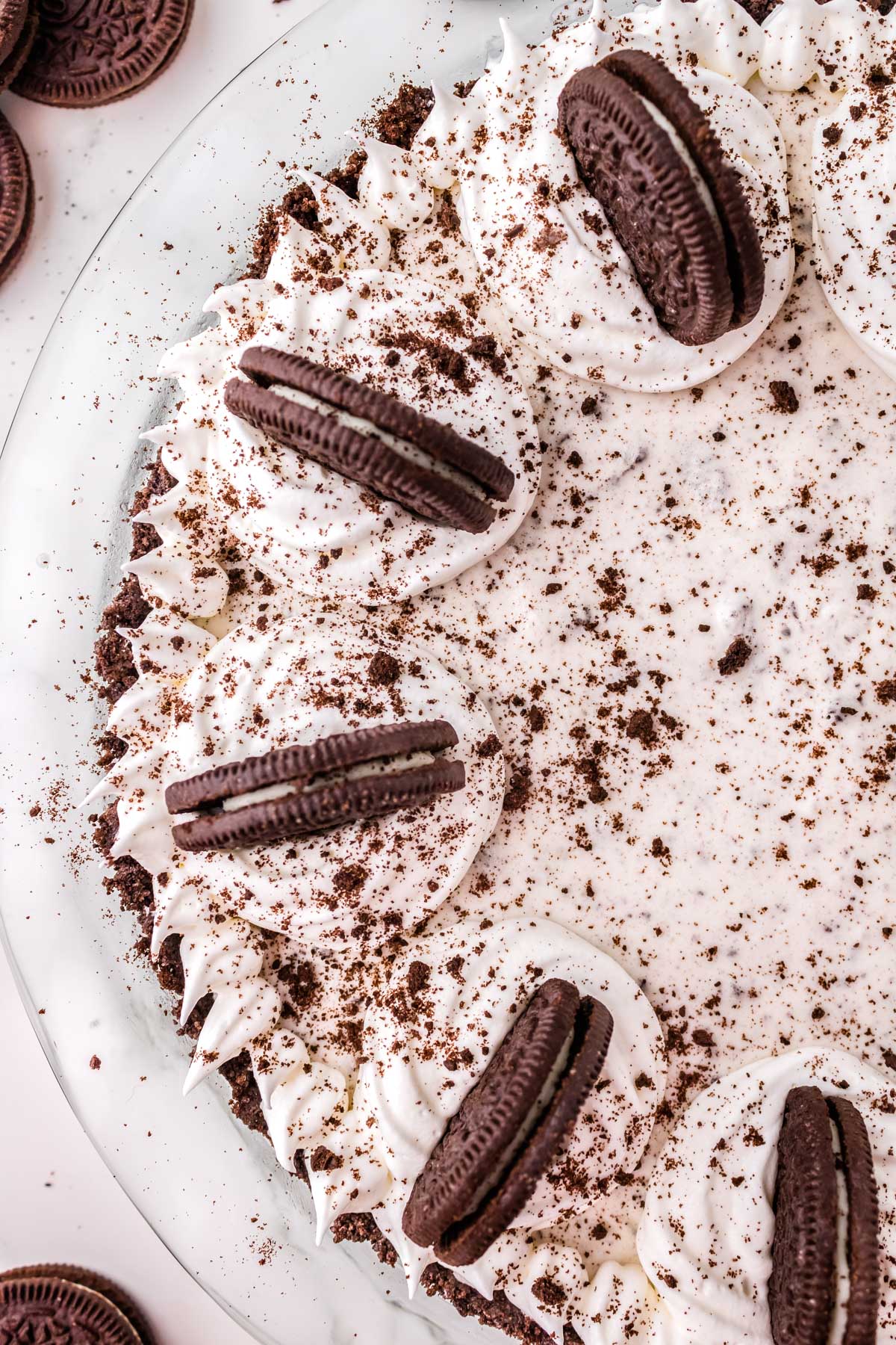 A close up picture of half of the finished Oreo Pie in a pie dish. 