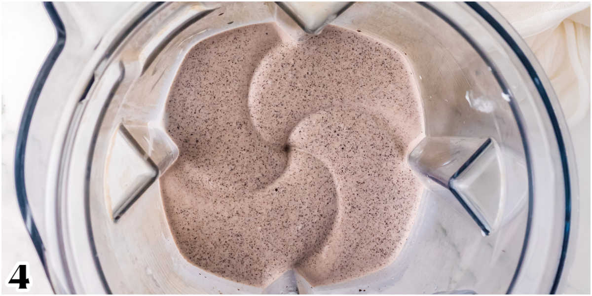 The milkshake blending in a blender.