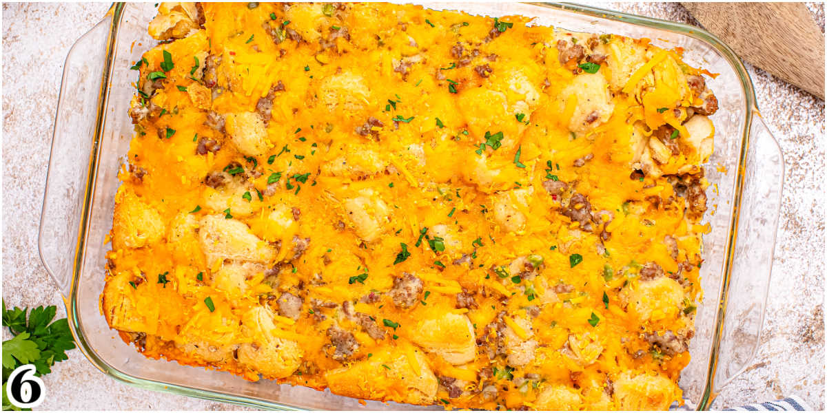 The finished biscuits and gravy casserole garnished with parsley.