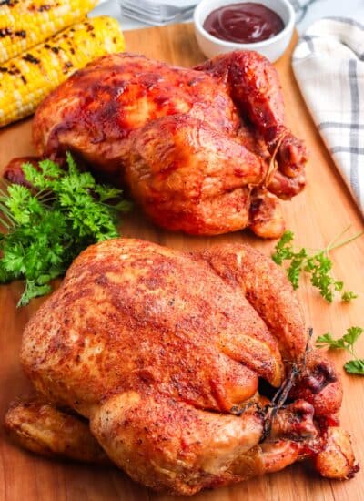 The finished Smoked Whole Chicken recipe on a cutting board.