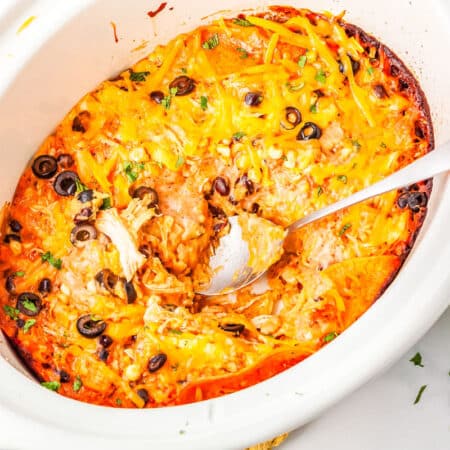 a crockpot of chicken enchilada casserole