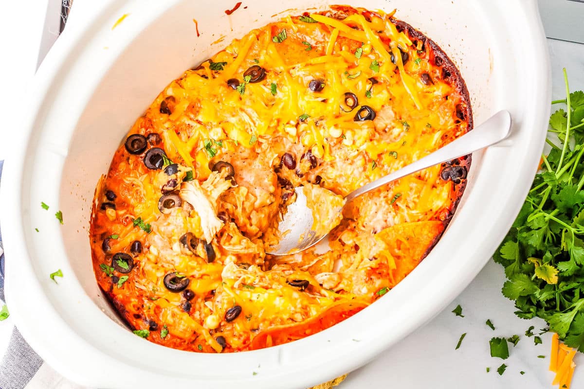 a crockpot of chicken enchilada casserole