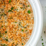 a crockpot with green bean casserole in it