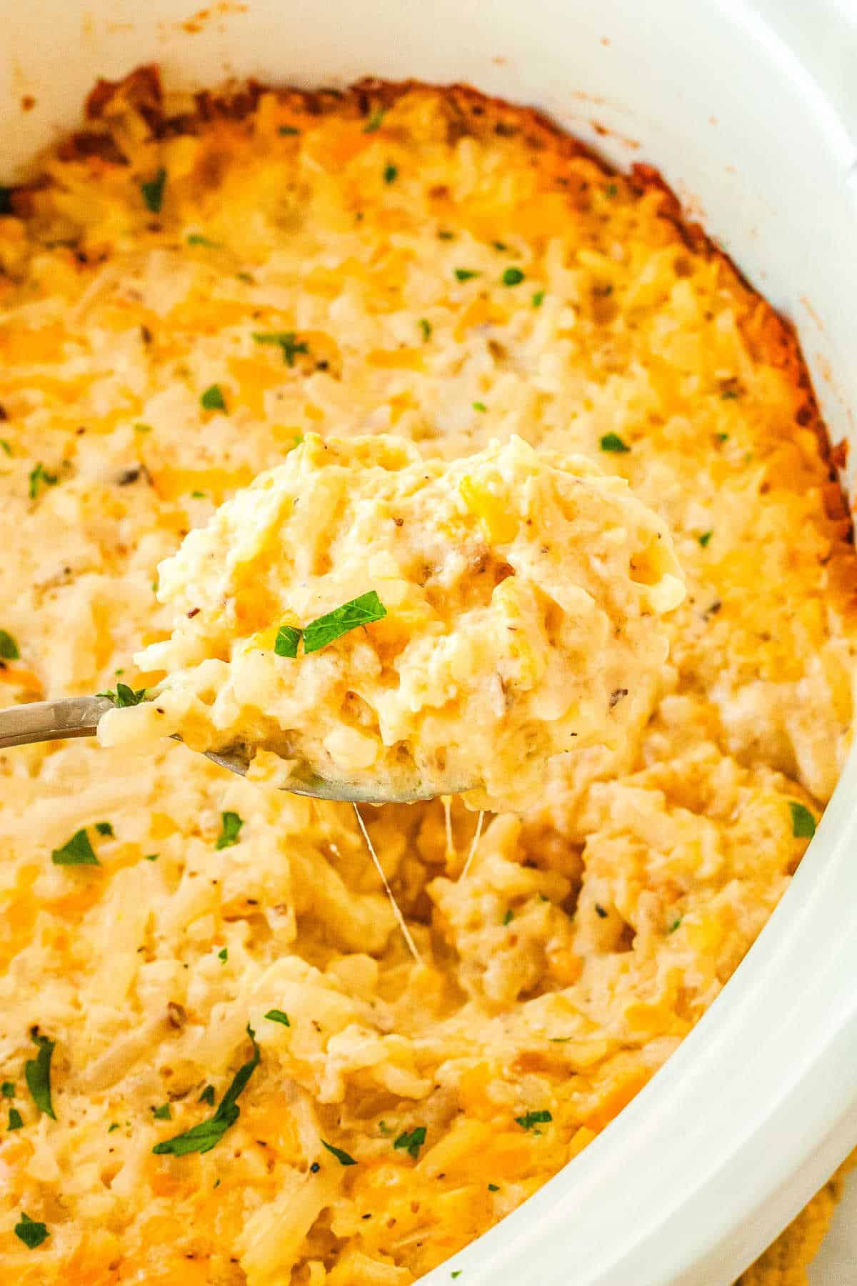 a crockpot with Cracker Barrel Hashbrown casserole in it