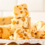 a stack of vanilla fudge pieces on a tray