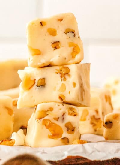 a stack of vanilla fudge pieces on a tray