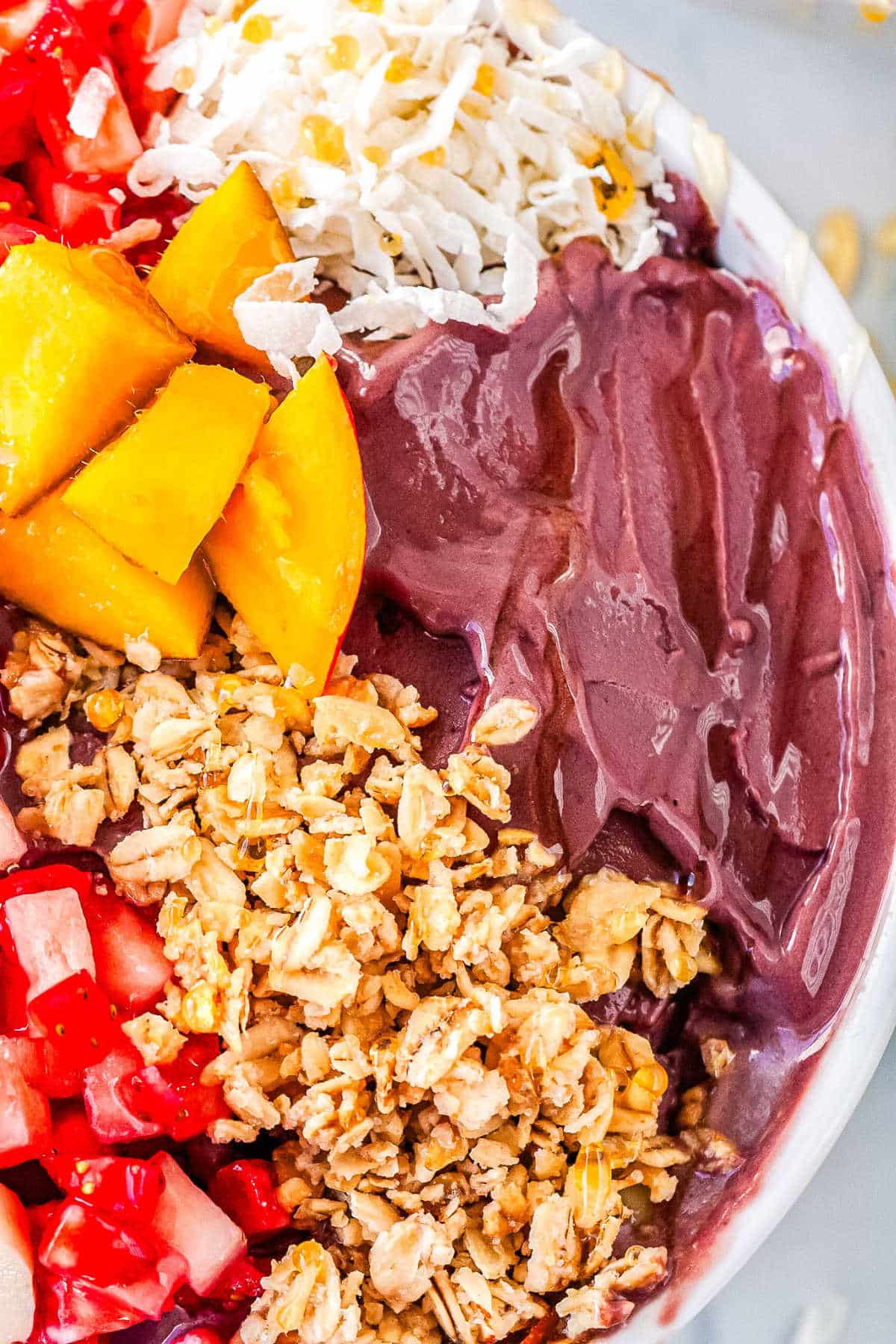 a close up of an acai bowl with various toppings